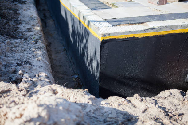 Professional Waterproofing technician working in Newport, TN